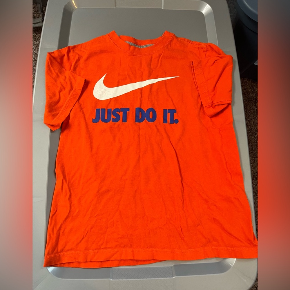 Nike boys size youth M orange short sleeve shirt.